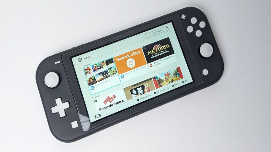 Nintendo Switch Lite (Б/В) + карта пам'яті 64Gb з іграми 3000 фото